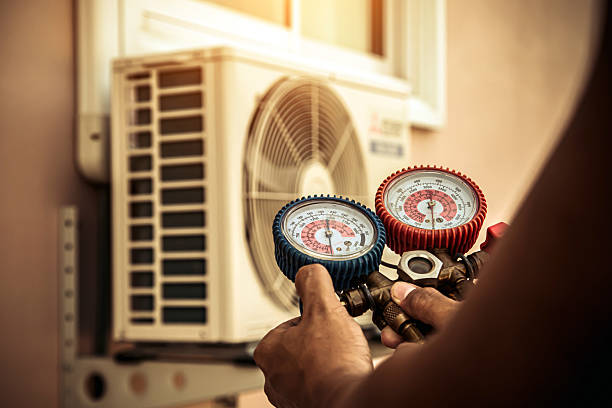 Professional Heat Pump Repair technician working in Freeport, TX